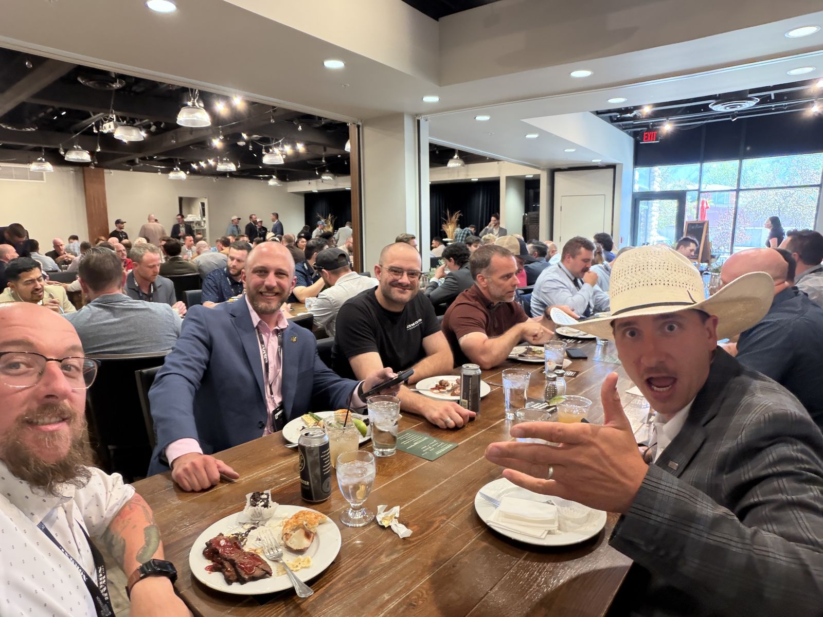 Reformed Business Alliance members gathered around a long table at a members dinner